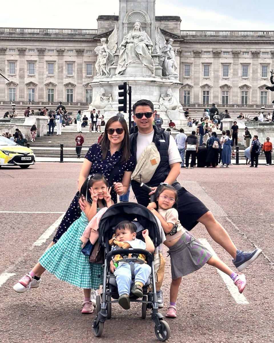 Jaze with his wife and three children in front of Buckingham Palace